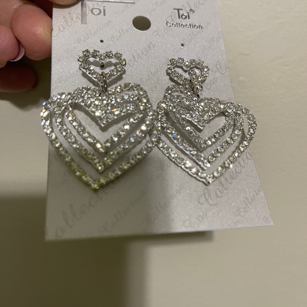 Brand new Toi Collection heart clear rhinestone earrings
